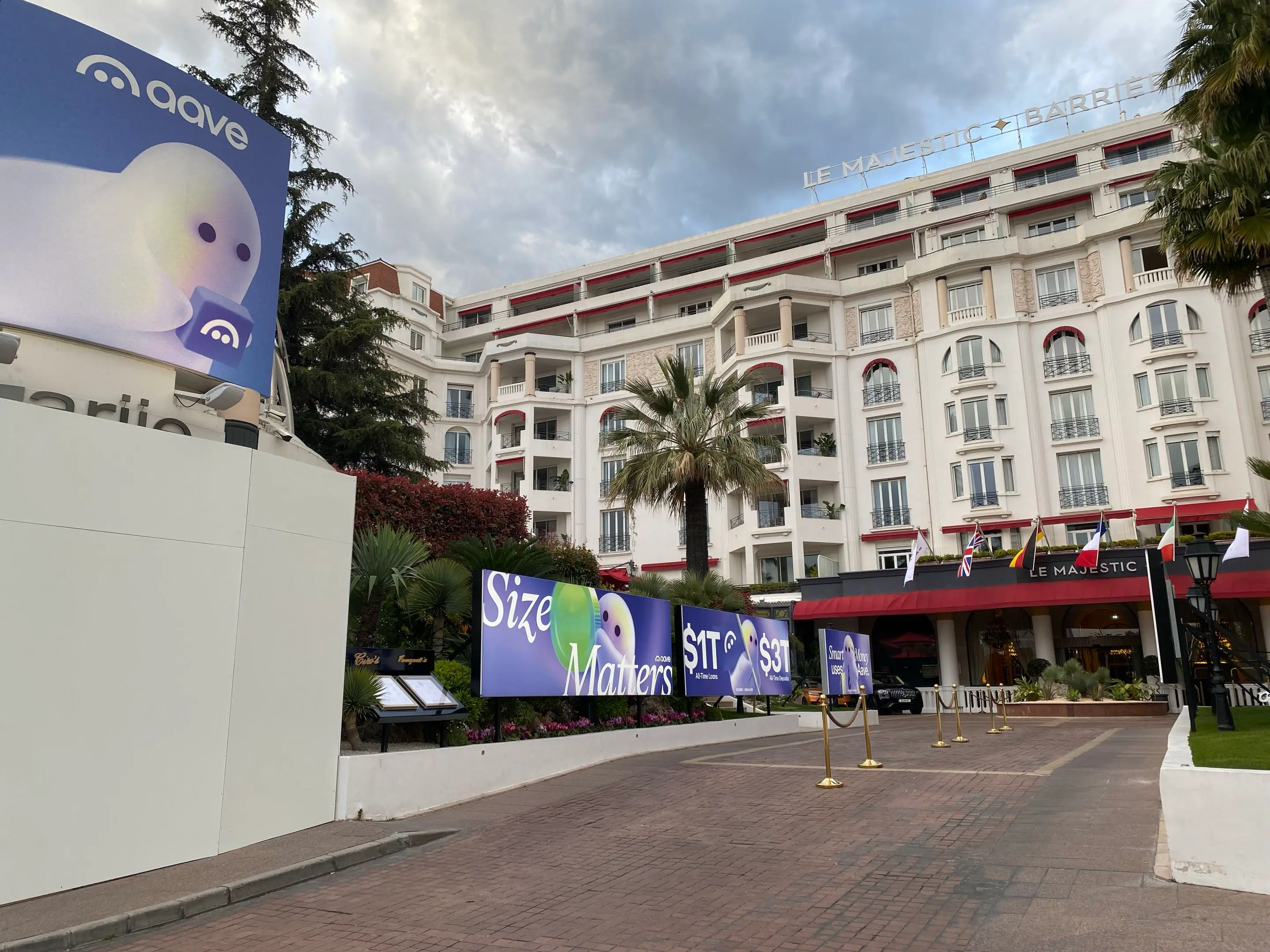 Aave billboards outside Hotel Barriere Majestic, one of the most expensive hotels in Cannes. Credit: Hilary B.